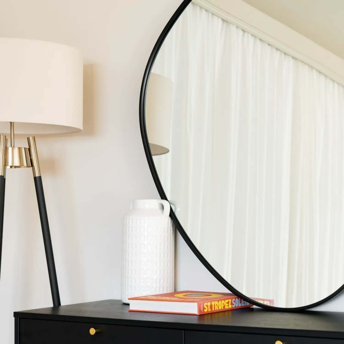 Izumi Black Metal Irregular Pebble Mirror - Elegant Statement for Modern Spaces